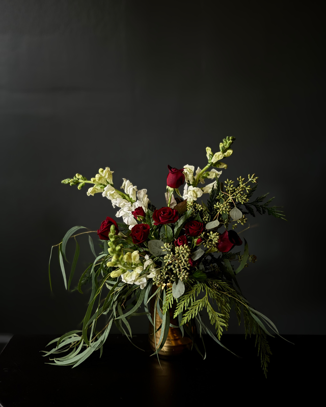 Dark and moody flowers with a hint of Christmas